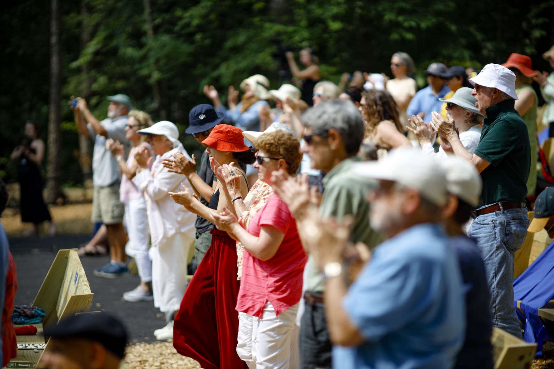 audience gives standing ovation at outdoor performance